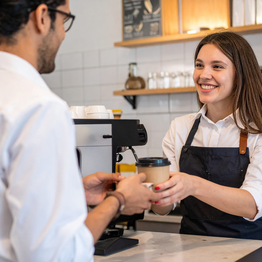 Staff scanning digital loyalty card at checkout
